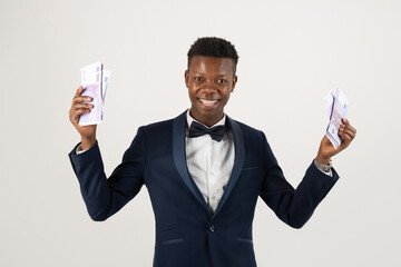 handsome young african man in suit with euro money on white background 