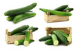fresh cucumbers in a wooden box on a white background