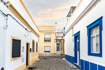 Wall Mural - Small houses on the narrow street of historic Olhao, Algarve, Portugal