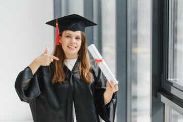 Graduation: Student Standing With Diploma