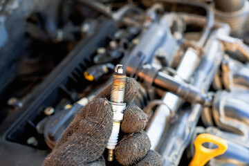 Wall Mural - replacing spark plugs in the car