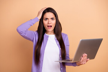 Poster - Photo of nice impressed brunette long hairdo lady hold laptop wear purple sweater isolated on pastel beige color background