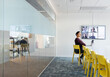 © Johnér - Woman in boardroom having video conference