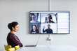© Johnér - Woman in boardroom having video conference