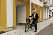 © Johnér - Senior woman with bicycle