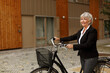 © Johnér - Senior woman with bicycle