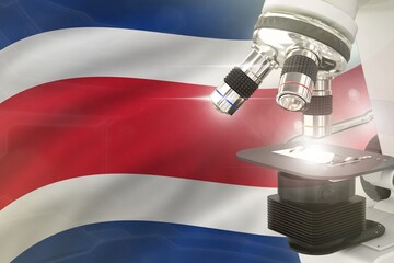 Wall Mural - Costa Rica science development concept - microscope on flag background. Research in chemistry or biology 3D illustration of object