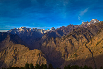 Mesmerizing view of Kamet, Parvati and Neelkanth mountains of Garhwal Himalayas from Kuari pass hiking trail near Auli, Uttrakhand, India.