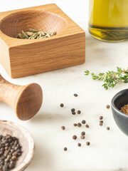 Wall Mural - Herbs and spices cooking on marble table.