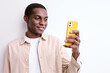 Handsome Black Guy Holding Smartphone In Hands