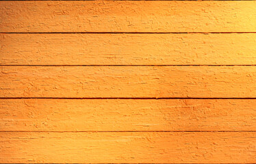 Wooden brown and yellow background of boards. Background with bright, peeling paint. The surface of the table top view