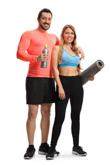 Wall Mural - Full length portrait of a young sporty man and woman with an exercise mat