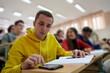 © .shock - Student using a calculator while calculating in a math class