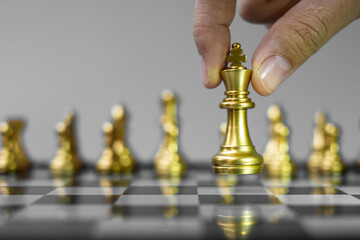 Wall Mural - gold Chess king figure Stand out from the crowd on Chessboard background. Strategy, leadership, business, teamwork, different, Unique and Human resource management concept