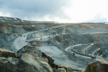 Wall Mural - Work of heavy equipment in an open pit