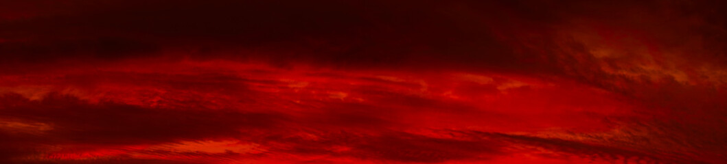 Wall Mural - red orange sunset background. dramatic sky with clouds. abstract red background with copy space for 
