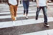 © Rawpixel.com - Streetwear apparel jeans men and women crossing road in city
