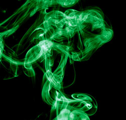 Green smoke isolated on black background. Abstraction