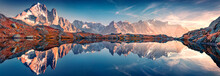 Panoramic Autumn View Of Cheserys Lake With Mount Blank On Background, Chamonix Location. Spectacular Outdoor Scene Of Vallon De Berard Nature Preserve, Alps, France, Europe.