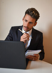 businessman in suit working at computer.