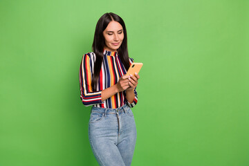 Poster - Portrait of attractive focused girl using device gadget app 5g browsing isolated over bright green color background