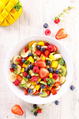 Wall Mural - colorful fresh juicy fruit salad