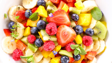Wall Mural - colorful fresh juicy fruit salad