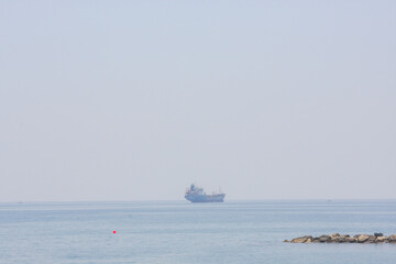 Ships on the seascape horizon, natural blue background, pure sky