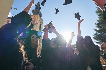 Group of diverse international graduating students celebrating