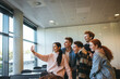 © Jacob Lund - Friends in a classroom taking group selfie