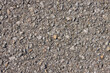 © steafpong - Zoom View Gravel or Pebble on Asphalt Road Texture Background in Natural Light