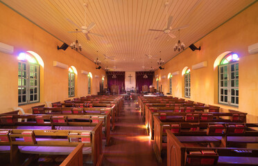 Interior of empty christian church with cross, architecture design. Religious beliefs. Catholic religion. Jesus worship.