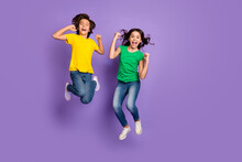 Full Body Photo Of Young Kids Happy Smile Jump Up Celebrate Win Victory Success Fists Hands Isolated Over Purple Color Background