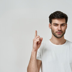 Wall Mural - Young bearded man wearing t-shirt raise thumb up