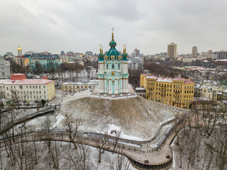 Wall Mural - St. Andrew's Church in Kiev in snowy weather. Aerial drone view.