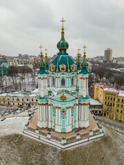 Wall Mural - St. Andrew's Church in Kiev in snowy weather. Aerial drone view.