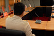 © ULTRAPOK - Blurred focus on the chairman of meeting (Thai government officer, Civil Servant) focus on the conference microphone stand, No attendance.