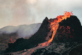 Volcanic eruption in Iceland, lava bursting from the volcano. Bright red magma.