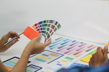 Wall Mural - smooth focus,a team of ui ux web designers are working together to develop a mobile responsive websi