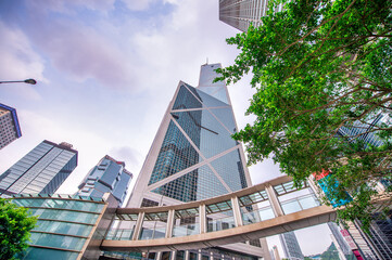 HONG KONG - MAY 2014: Hong Kong skyline from a city street on a cloudy sunset