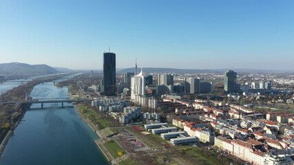 Wall Mural - Vienna Danube and City aerial panoramic view. Donaustadt Kagran district and Kaiserwasser at the Danube. Modern city quarter with skyscrapers and business office centres in the capital of Austria.