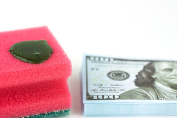 dish washing sponges on money, a concept of money laundering