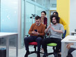 © .shock - Multiethnic startup group at office chair race
