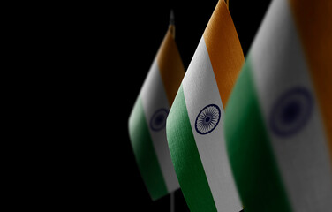 Wall Mural - Small national flags of the India on a black background