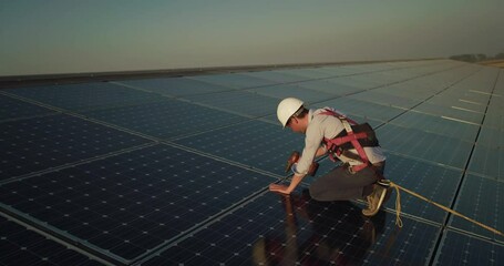 Wall Mural - cinematic shot of assistance technical worker in uniform checking operation and efficiency of photov