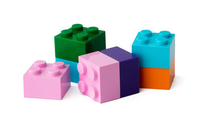 Colorful plastic toy building blocks isolated on white