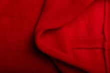 Texture Of Red Fleece Fabric And The Inside Or Back Side Of It, Background Or Backdrop. Clothing, Sewing, Gressmaking, Haberdashery. Copy Space.