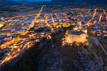 Wall Mural - Scenic night view of illuminated hilltop walled castle in Castalla town on background with cityscape, Alicante, Spain