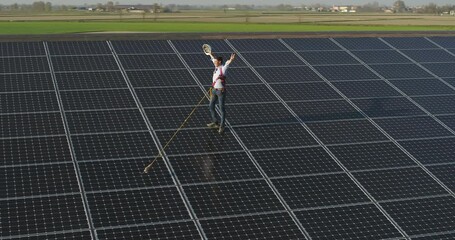Wall Mural - aerial shot of maintenance assistance technical worker in uniform is smiling satisfied of his work a