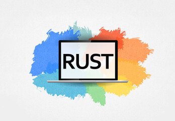  RUST programming language. word Rust on laptop and colorful background
